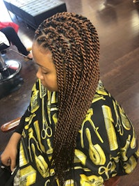 a woman with braided hair in a salon