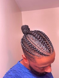 a man with braids in his hair